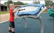  ??  ?? Above: The new playground in Fort Oglethorpe is even musical, featuring a working giant xylophone. Below, Right: The new playground at Gilbert-stephenson Park includes a maze of slides and bridges children are thoroughly enjoying. Below,
A four-seater see-saw is part of the new playground.