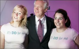  ??  ?? BLUNDER: David Davis poses with two aides wearing ‘It’s DD for me’ T-shirts