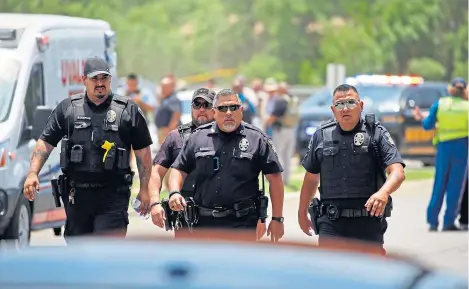  ?? ?? First responders assemble near Robb Elementary School in Texas following the mass shooting.