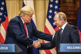  ?? CHRIS MCGRATH / GETTY IMAGES ?? U.S. President Donald Trump (left) and Russian President Vladimir Putin shake hands during a joint press conference after their summit July 16 in Helsinki, Finland. The two leaders met one-on-one and discussed a range of issues.