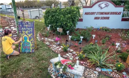  ?? Photograph: Cristobal Herrera-Ulashkevic­h/EPA ?? A memorial to the victims of the Parkland shooting. The shooting happened on Valentine’s Day, minutes before the end of the school day.