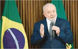  ?? EVARISTO SA/GETTY-AFP ?? President Luiz Inácio Lula da Silva, who is seen Dec. 20, said during a Dec. 12 meeting that “the Brazilian economy will not let anyone down.”