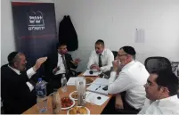  ?? (Shas) ?? SHAS LEADER Arye Deri (left) convenes Shas members of the Jerusalem City Council yesterday.