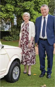  ??  ?? Anne and David Taylor with one of the Taylor’s Removals’ old vehicle fleet at the centenary celebratio­ns.