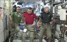  ?? THE ASSOCIATED PRESS ?? Joe Acaba, left, the first astronaut of Puerto Rican heritage, alongside Italy’s Paolo Nespoli, centre, and Mark Vande Hei from the Internatio­nal Space Station Wednesday.