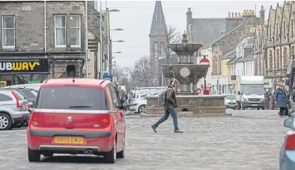  ?? Picture: Steven Brown. ?? Would Market Street in St Andrews benefit from having cars banned?