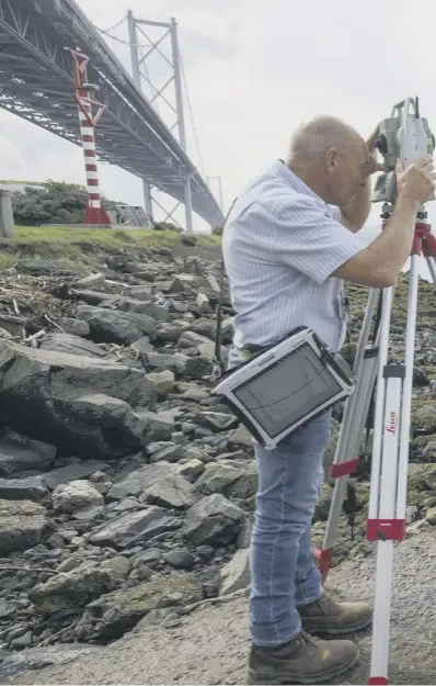  ??  ?? 0 Masters of all they survey: Ordnance Survey staff have mapped the new bridge and its approaches to