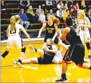  ?? MARK HUMPHREY ENTERPRISE-LEADER ?? Players from both teams converge as Prairie Grove sophomore Zoe Hobbs battles a West Fork player for control of the basketball. West Fork broke away from a 35-35 tie at the end of the third quarter to hand Prairie Grove a 52-42 loss on Thursday, Nov. 14, during the Duel at the Dome girls basketball tournament.