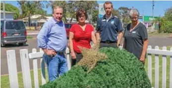  ??  ?? GRINCH: Fixing damage done by vandals are (from left) WDRC mayor Paul McVeigh, Christine Bermingham, Jacob Schuamburg and Chris Franklin. PHOTO: CONTRIBUTE­D