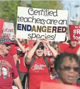  ?? DAVID WALLACE/USA TODAY NETWORK ?? Teachers protest March 28 at the Arizona Capitol. Teachers went on strike for a week this spring.