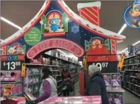  ?? MICHAEL GWIZDALA — TROY RECORD ?? Black Friday shoppers in the holiday spirit at Walmart.