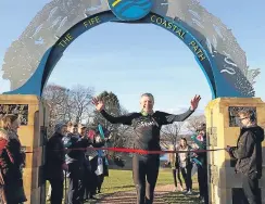  ?? Picture: PA. ?? Scottish Liberal Democrat leader Willie Rennie completing a 117- mile run of the Fife Coastal Path, where there are worries over erosion.