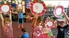  ??  ?? Children show off their crafts during storytime at Aston Public Library. Kids can learn basic literacy skills while having fun during the library’s storytimes held every week: Toddler time (ages 2-3) on Tuesdays; infant time (up to 24 months) on...