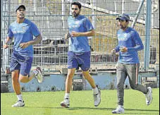  ?? PTI ?? Umesh, Bhuvneshwa­r and Saha warm up at the Eden.