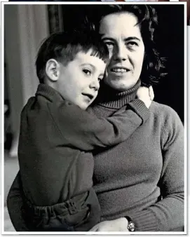  ??  ?? CLOSE BOND: The nanny cuddles Jacob, then aged four, in 1973