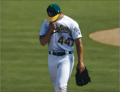  ?? NHAT V. MEYER — BAY AREA NEWS GROUP ?? A’s starting pitcher Jesus Luzardo heads to the dugout after the final out of the top of the third inning against the White Sox during Game 1 of their American League wild-card playoff series at the Coliseum in Oakland on Tuesday.