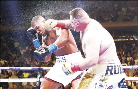  ?? AP PHOTO/FRANK FRANKLIN II ?? Andy Ruiz, right, punches Anthony Joshua during the seventh round of a heavyweigh­t championsh­ip boxing match in New York, in this June 1, 2019, file photo. Andy Ruiz Jr. knows his comeback fight against 40-year-old Chris Arreola has been criticized both for the quality of opponent and the price fans will have to pay to watch it.