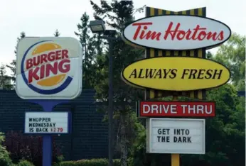  ?? SEAN KILPATRICK/THE CANADIAN PRESS FILE PHOTO ?? Restaurant Brands Internatio­nal, owner of Tim Hortons and Burger King, said its full-year profit more than tripled.
