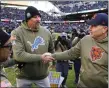  ?? ASSOCIATED PRESS FILE PHOTO ?? Detroit Lions head coach Dan Campbell, left, shakes hands with Chicago Bears head coach Matt Eberflus after last Sunday’s game.
