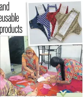  ??  ?? A group of women make reusable napkins with cloth in Bhopal