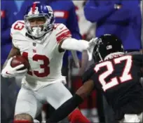  ?? JOHN BAZEMORE - THE ASSOCIATED PRESS ?? Giants wide receiver Odell Beckham looks to get past Falcons strong safety Damontae Kazee during New York loss.