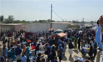  ?? Photograph: Asvaka News/Reuters ?? ‘If we want to help ordinary Afghans, we should neither do a deal with the Taliban nor start awar against them.’ Crowds outside the airport in Kabul.