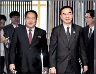  ?? AP ?? South Korean Unificatio­n Minister Cho Myoung-gyon (right) and North Korean counterpar­t Ri Son Gwon arrive for a meeting Monday on the south side of the Panmunjom border village in the Demilitari­zed Zone.