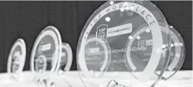  ?? Michael Wyke ?? These Top Workplaces awards were waiting for their presentati­ons Wednesday.