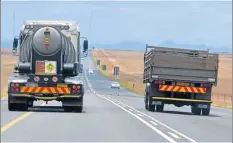  ??  ?? PUSHING THROUGH: A heavy truck ignores the double white line