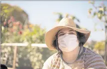  ?? JON LOK — UCSF ?? Sarah works in her community garden on Sept. 25. “My best self is able to stay in control. I just get on with my day,” she says. “It’s something I can manage.”