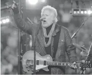  ?? ED KAISER/ POSTMEDIA NEWS ?? Randy Bachman, shown here performing at the 2010 Grey Cup in Edmonton, considers himself a guitar player first.