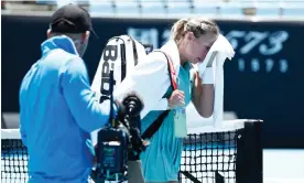  ?? Photograph: Daniel Pockett/Getty Images ?? Anett Kontaveit of Estonia walks off 1573 Arena after play was suspended due to extreme heat in her match against Julia Grabher of Austria.