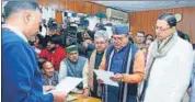  ?? HT PHOTO ?? BJP state president Mahendra Bhatt files nomination papers for Rajya Sabha elections in the presence of party’s state unit incharge Dushyant Kumar Gautam and chief minister Pushkar Singh Dhami on Thursday.