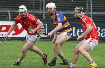  ??  ?? The Dwyer brothers, Ciarán and Mikie, outnumberi­ng a John Lockes opponent in Saturday’s final.