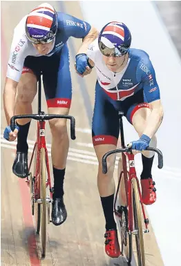  ?? Picture: PA. ?? Mark Stewart, right, and Chris Latham competing in the men’s madison on the third day of action in Manchester,