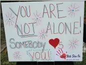  ?? DEBRA DC FERRELL ?? Debra Ferrell placed this sign with encouragin­g words in a neighbor’s yard in Roanoke, Virginia.