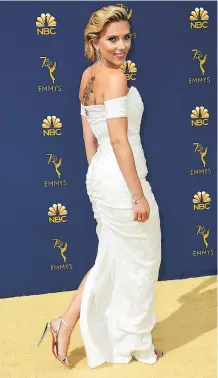  ?? PHOTOS: THE ASSOCIATED PRESS ?? Scarlett Johansson made a statement on the gold carpet in a stunning white gown with a plunging neckline and high side slit.
