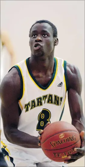  ?? TROY Fleece/leader-post ?? Campbell Tartans’ Richie Sindani at the free-throw line against the Neelin Spartans in senior boys basketball at the Campbell Invitation­al Tournename­nt on Thursday.