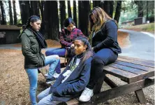  ?? Gabrielle Lurie / The Chronicle ?? Susan Santamaria, 16 (right), braids Carmel Evans’ hair before they depart after the four-day Camp Everytown retreat.