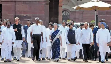  ?? G.N. JHA ?? Opposition leader Ghulam Nabi Azad, Congress president Sonia Gandhi and former Prime Minister Manmohan Singh with leaders of 13 Opposition parties, including the Congress, the TMC, the NCP and Left parties, after meeting President Pranab Mukherjee in...