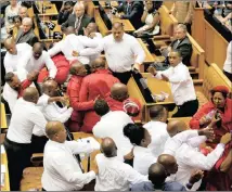  ??  ?? KICKED OUT: Security officials remove members of the Economic Freedom Fighters during President Jacob Zuma’s speech last year.