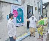  ?? PRAFUL GANGURDE / HT PHOTO ?? Health workers raise awareness about Covid vaccinatio­n in a village in Thane on Friday.