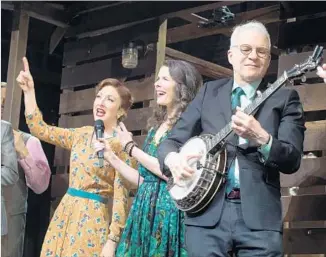  ?? Charles Sykes Invision / Associated Press ?? MARTIN accompanie­s Carmen Cusack, left, and Edie Brickell during a curtain call for “Bright Star,” which he co-wrote with Brickell. The Tony-nominated musical closed recently on Broadway.