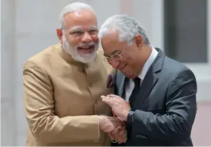  ?? AP ?? Portuguese PM Antonio Costa greets Narendra Modi at the Necessidad­es Palace on Saturday. —