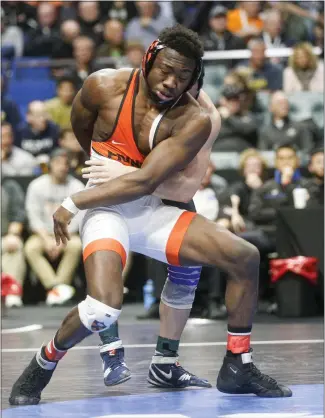  ?? IAN MAULE —VTULSA WORLD VIA AP ?? Princeton’s Quincy Monday attempts to escape from Michigan’s Cameron Amine at the NCAA Division I wrestling championsh­ips on Saturday in Tulsa, Okla.