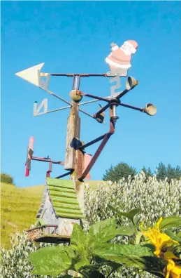  ??  ?? Father Christmas knows which way the wind blows . . . Ian Yalden photograph­ed this festive wind vane last month.