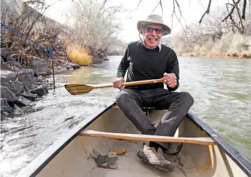  ?? GABRIELA CAMPOS/THE NEW MEXICAN ?? Shel Neymark canoes Nov. 13 across the river to his studio in Embudo. Neymark is a recipient of The 10 Who Made a Difference Award for helping to create the Embudo Valley Library and Community Center in the middle of Dixon.