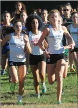  ?? Photo by Ernest A. Brown ?? Adah Anderson (right) and the Cumberland girls cross country team finished the dual-meet season undefeated to win the Northern Division title at the Cumberland Monastery.