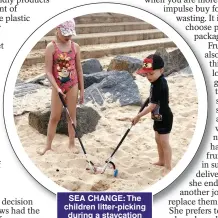  ?? ?? SEA CHANGE: The children litter-picking during a staycation