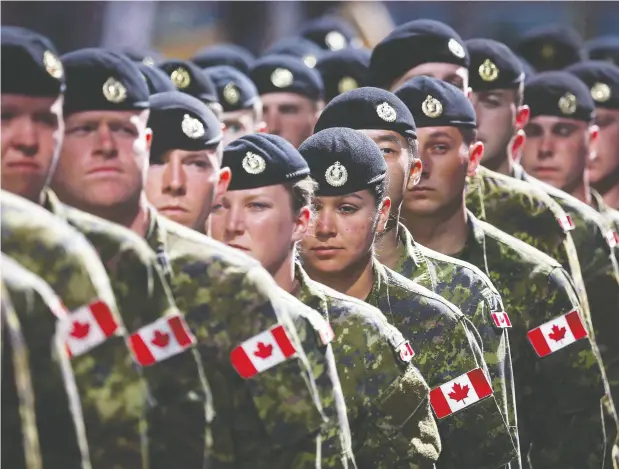  ?? JEFF MCINTOSH / THE CANADIAN PRESS ?? Members of the Canadian Armed Forces march during the Calgary Stampede parade in July 2016. Prime Minister Justin Trudeau’s chief of staff, Katie Telford, testified for nearly two hours before the Standing Committee on National Defence Friday/